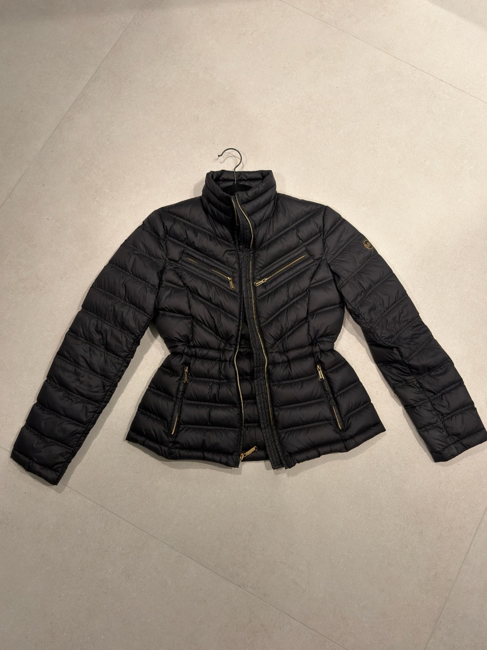 Michael kors Black puffer jacket with gold accents and adjustable waist